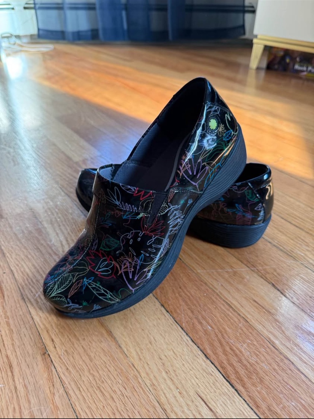 Dansko Black Patent Slip-On Clogs with Multicolor Floral Sketches